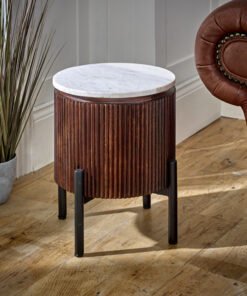 Opal Mango Wood Side Table with a white marble top and vertical ribbed brown body, mounted on black metal legs, set near a brown leather armchair.