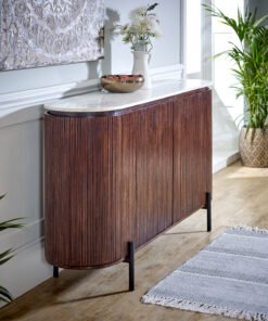 Opal Mango Wood Sideboard with real white marble top and black metal legs in a dark brown ribbed mango wood finish, placed in a bright entry hall with potted plants.