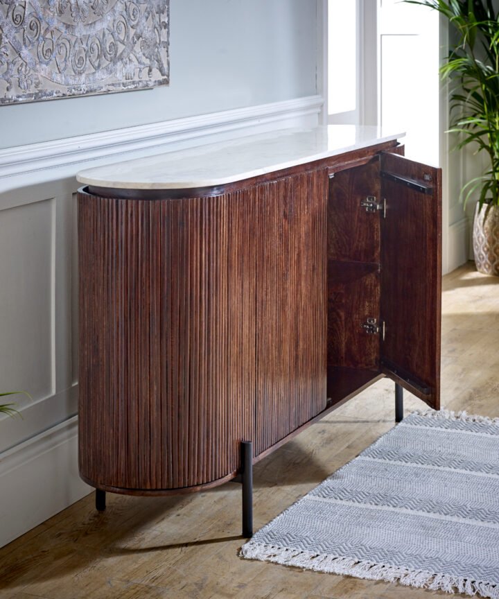 Opal Mango Wood Sideboard with a real white marble top and metal legs in a warm brown mango wood finish, shown with a curved silhouette and paneled doors.