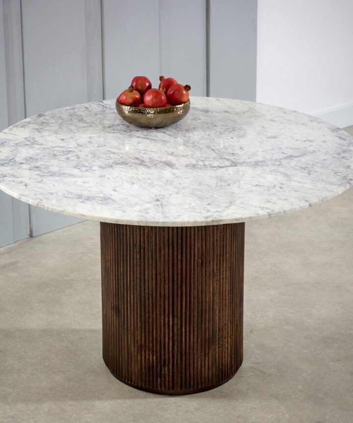 Opal Mango Wood round dining table with a white marble top and a dark ribbed mango wood base, handcrafted in India