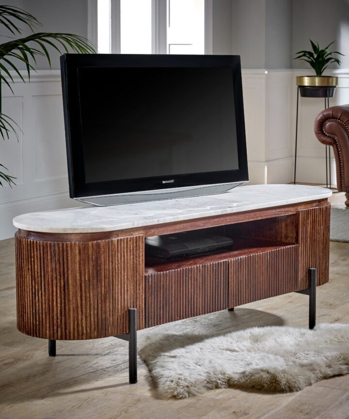 Opal Mango Wood TV Cabinet with Marble Top and metal legs in a warm brown ribbed finish, featuring a flat-screen TV and a decorative living room setting.