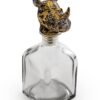 Large Glass Storage Bottle with Rhino Head Stopper in clear glass, topped with a metallic rhino head for rugged storage style.