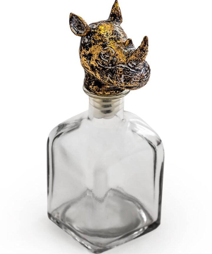 Large Glass Storage Bottle with Rhino Head Stopper in clear glass, topped with a metallic rhino head for rugged storage style.