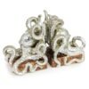 Polished silver octopus pair of bookends with detailed suckers and sweeping tentacles, crafted as a dynamic two-piece set for books.